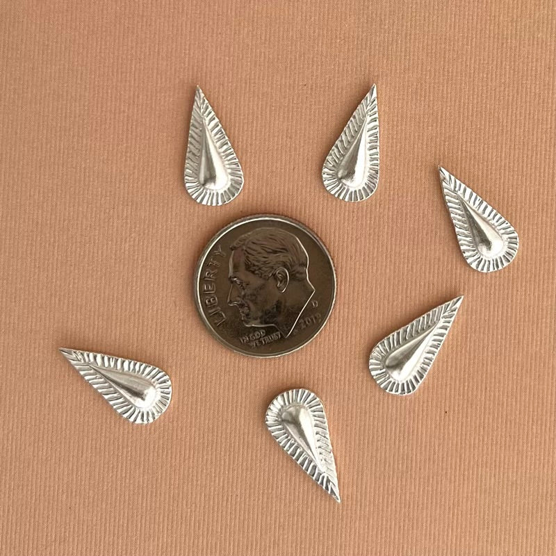 silver teardrop concho